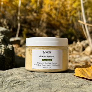 Saach face mask powder in a jar, natural skincare product for face, with a textured, earthy appearance and herbal ingredients.
