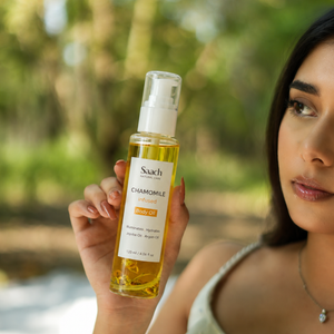 Saach Chamomile Infused Body Oil bottle with golden oil, featuring chamomile flowers and a natural, soothing appearance