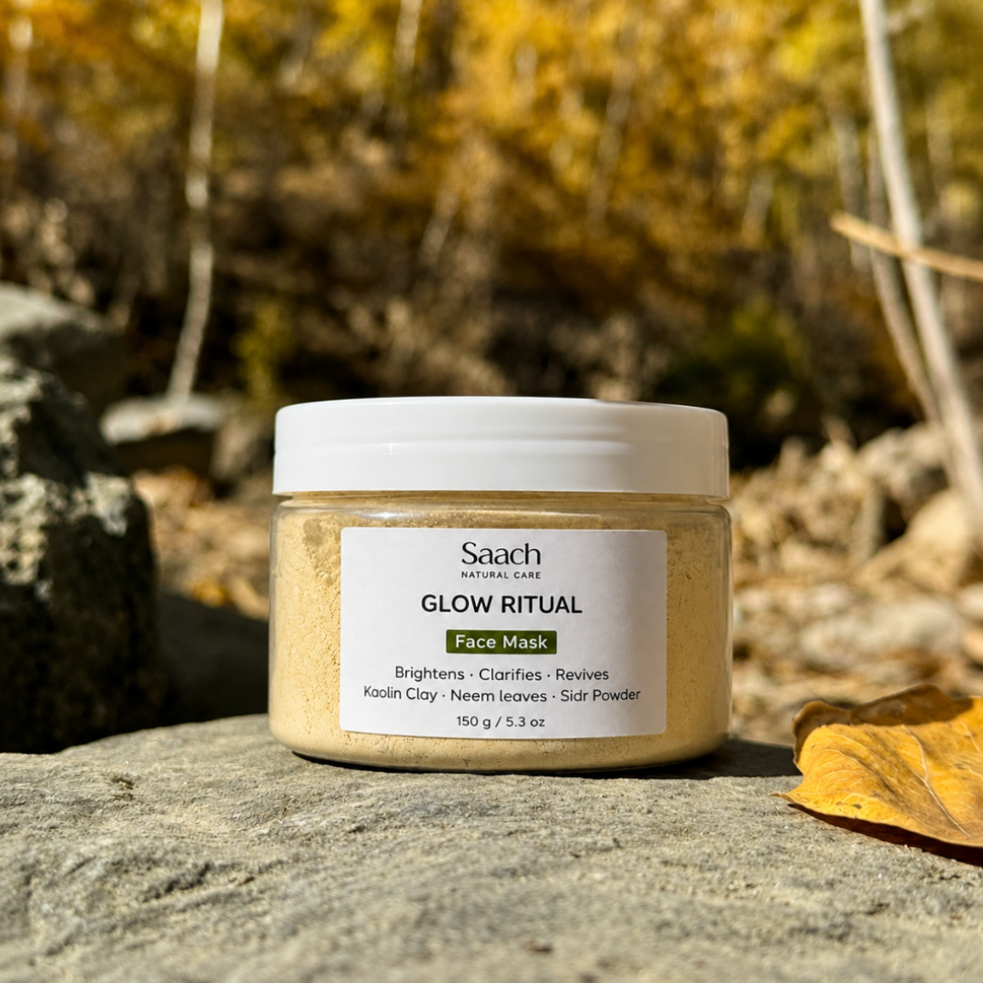 Saach face mask powder in a jar, natural skincare product for face, with a textured, earthy appearance and herbal ingredients.