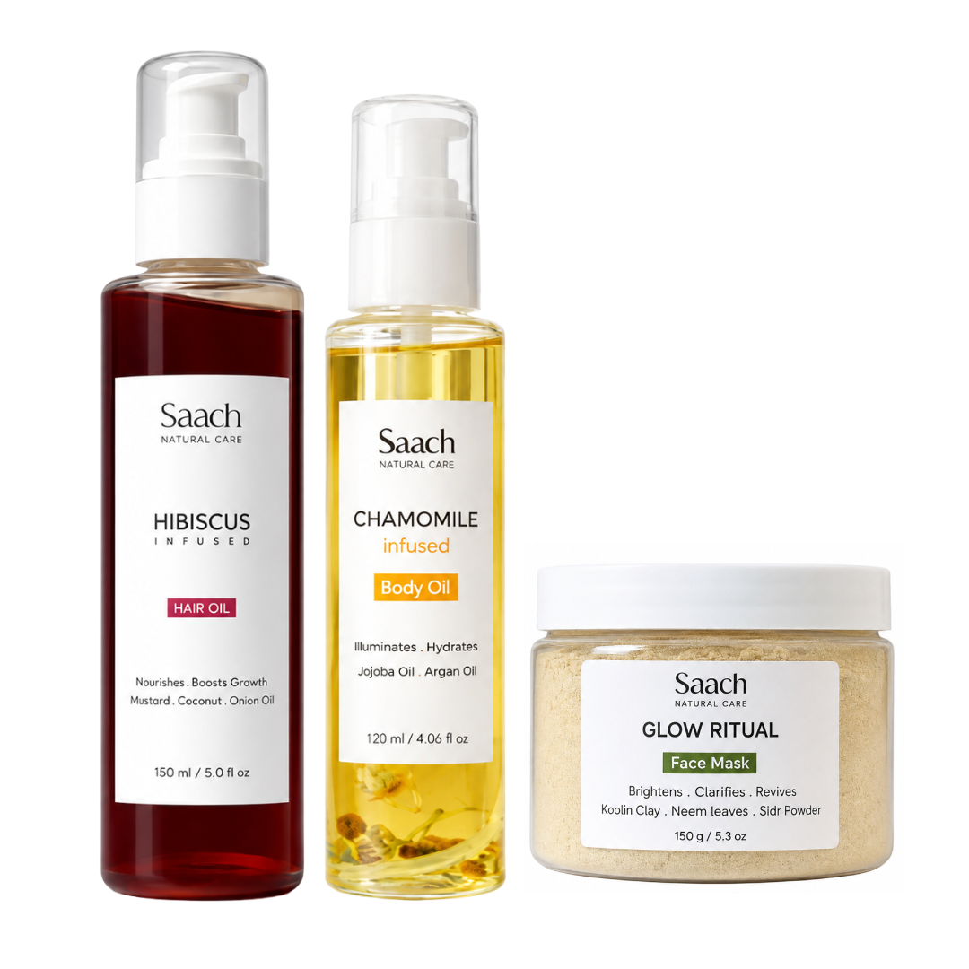 Saach Signature Set with body oil, hair oil, and face mask displayed in elegant containers on a wooden surface.
